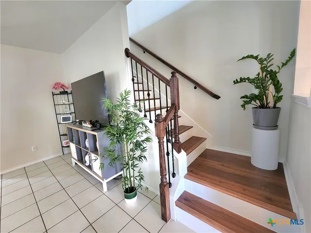 a view of entryway with wooden floor