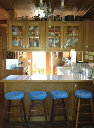 70 Indian Neck Road Wellfleet, MA 02667 - Photo 5 of 9 a kitchen with a table and chairs in it