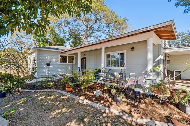 a view of house with backyard