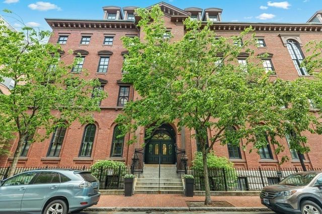 a view of a building with a street