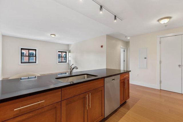 a spacious bathroom with double sink and a mirror