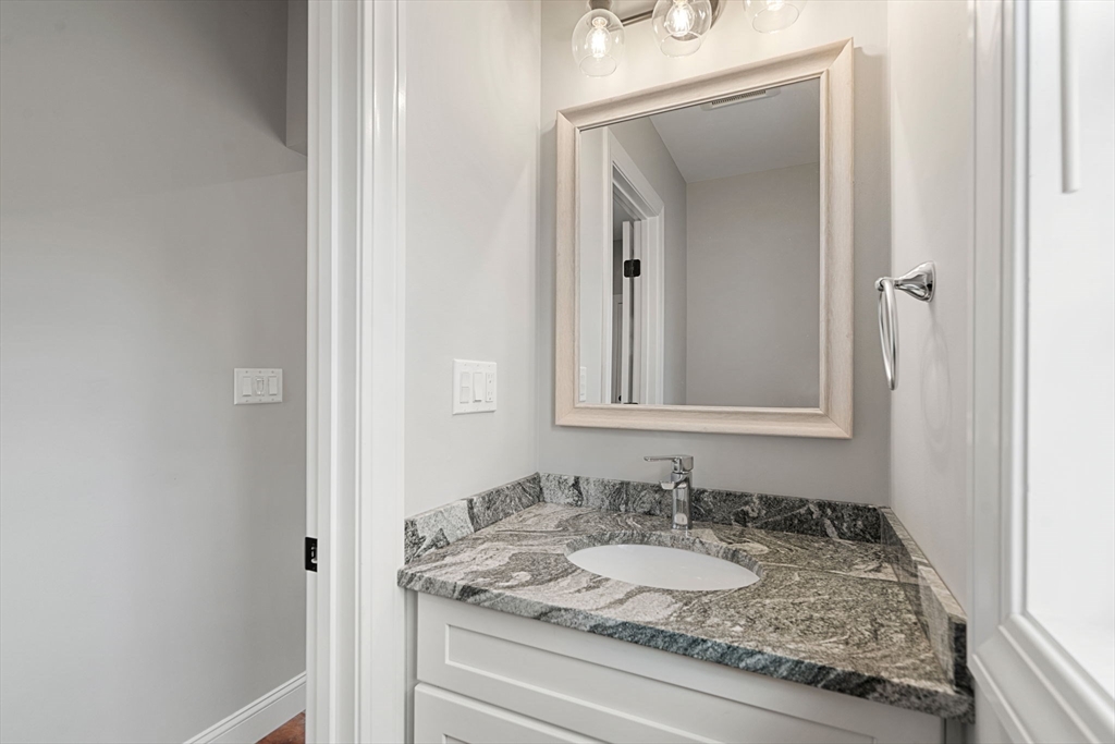 249 Brookside Road Orange, MA 01364 - Photo 29 of 37 a bathroom with a granite countertop sink and a mirror