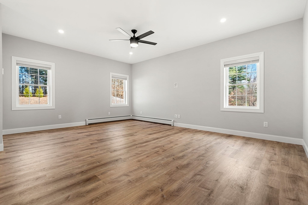 249 Brookside Road Orange, MA 01364 - Photo 30 of 37 a view of an empty room with wooden floor and a window