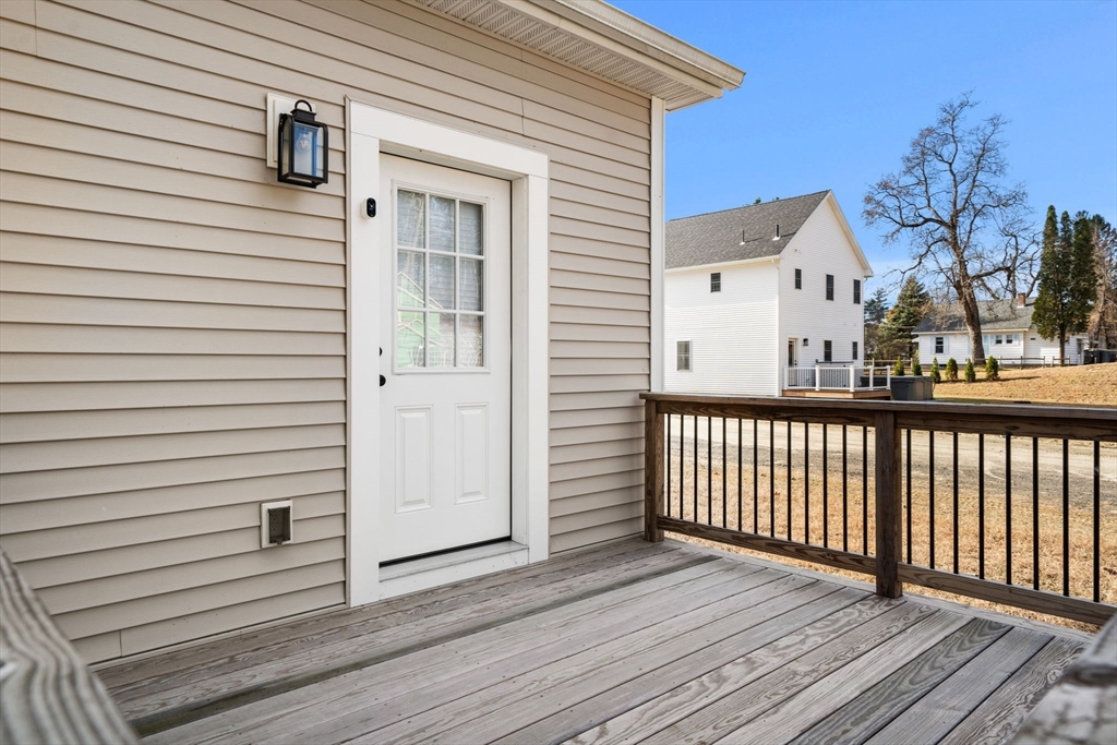 249 Brookside Road Orange, MA 01364 - Photo 37 of 37 a view of a house with wooden deck