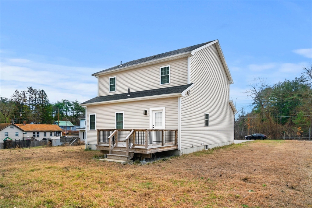 249 Brookside Road Orange, MA 01364 - Photo 4 of 37 a view of a house with backyard and sitting area
