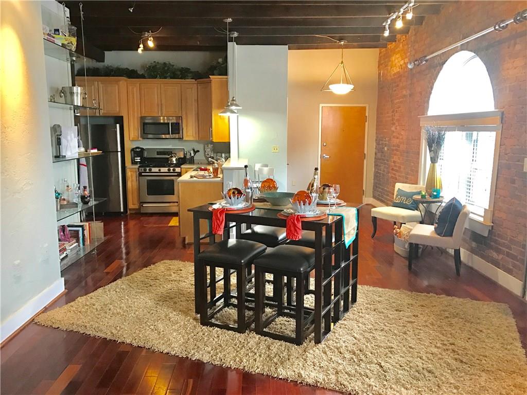 267 Peters Street Southwest, Unit 207 Atlanta, GA 30313 - Photo 1 of 1 Welcome to 267 Peters St Unit 207, this is a Loft. Exposed brick, hardwood floors, exposed beams, lots of space and natural light. View from the Living Room to the Kitchen: provides space for dinning and walk out to the balcony.