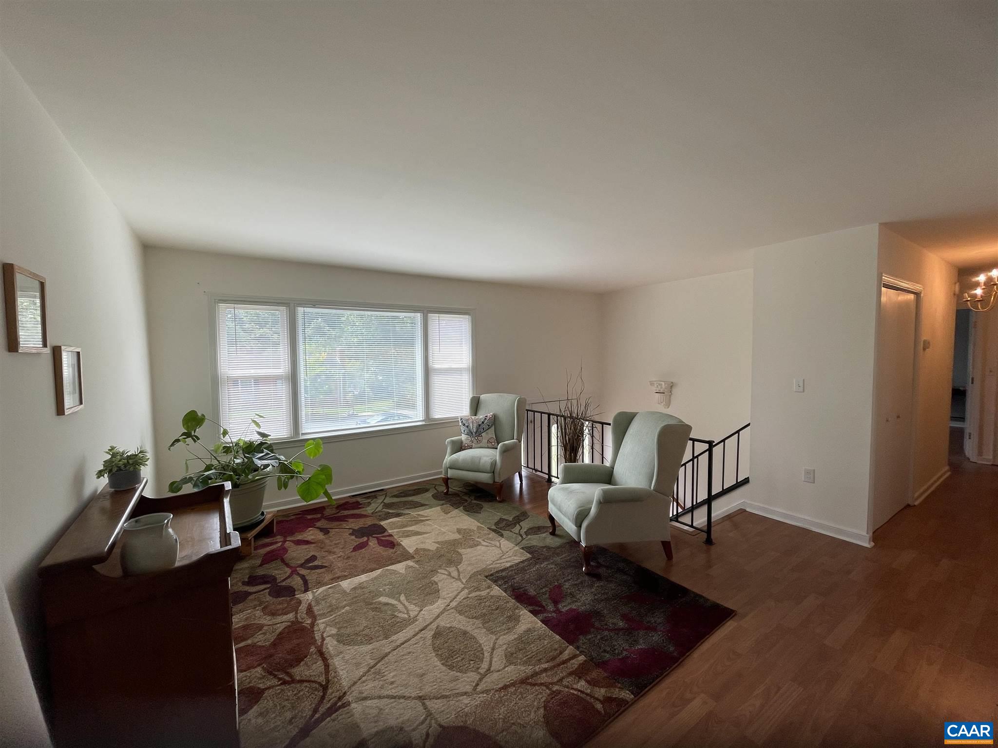 2309 Wakefield Road Charlottesville, VA 22901 - Photo 3 of 28 a living room with furniture and wooden floor