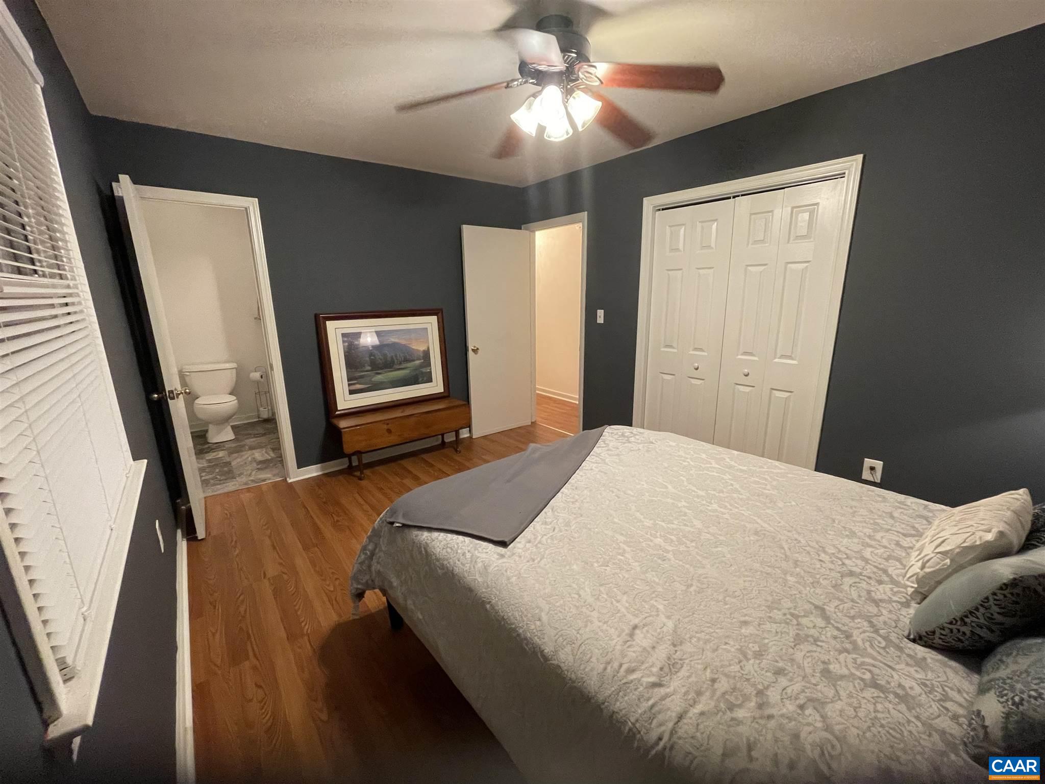 2309 Wakefield Road Charlottesville, VA 22901 - Photo 4 of 28 a bedroom with a bed and a flat tv screen on dresser