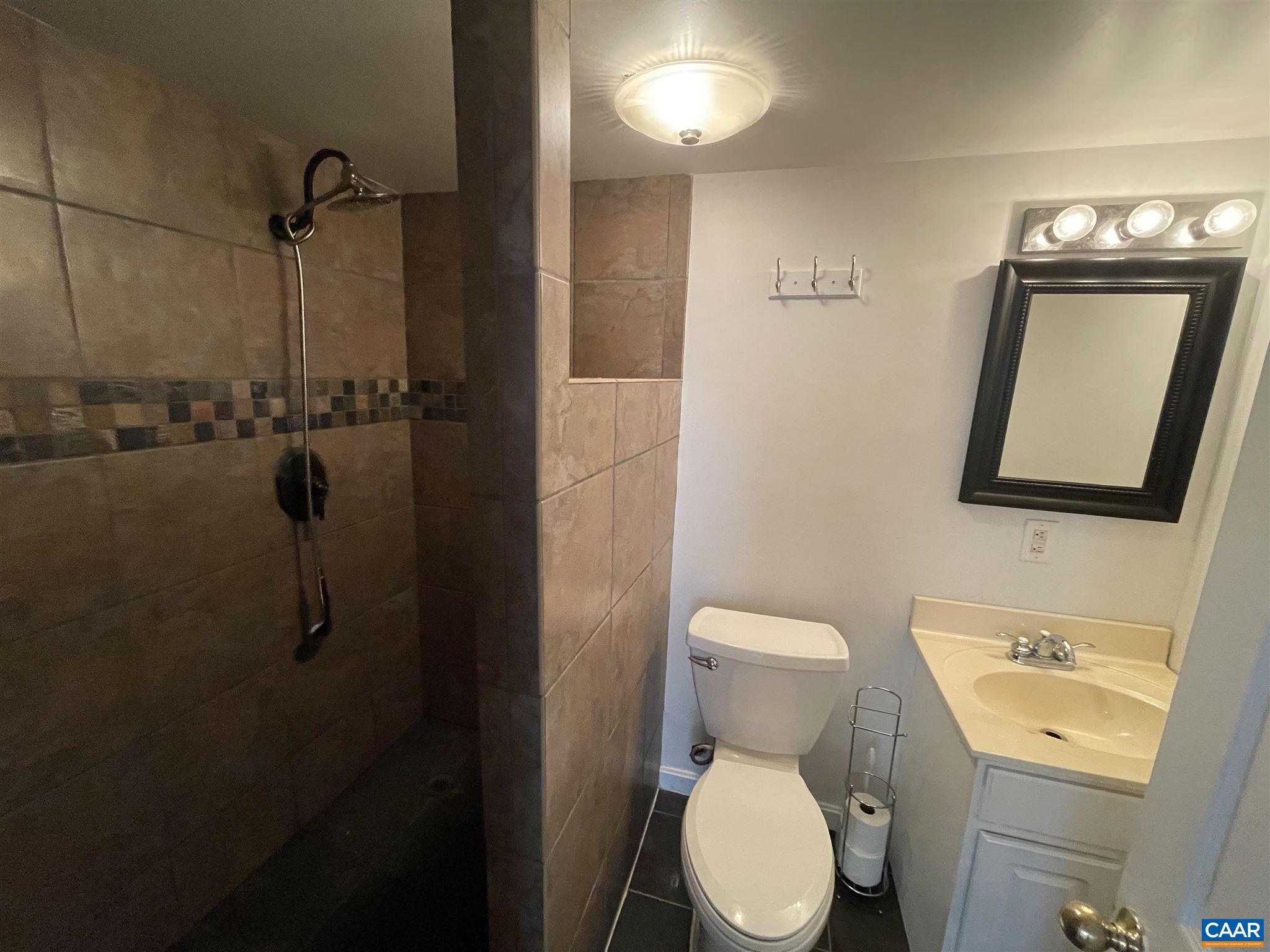 2309 Wakefield Road Charlottesville, VA 22901 - Photo 6 of 28 a bathroom with a toilet sink and shower