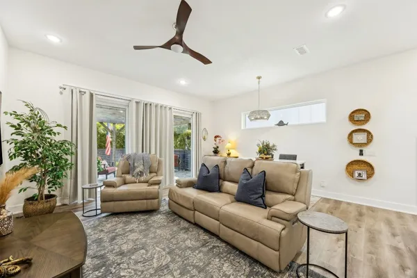 a livingroom with furniture and a flat screen tv