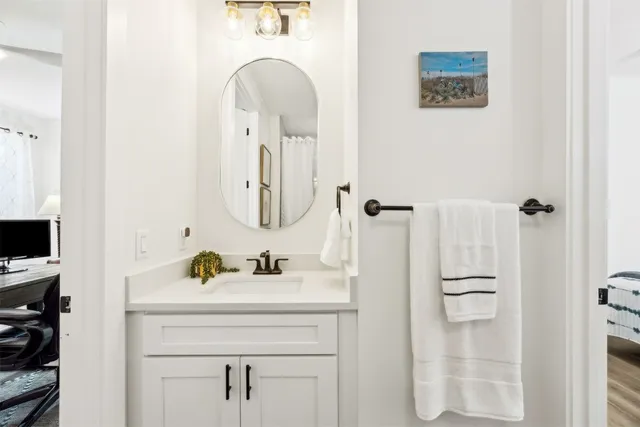 a white toilet sitting next to a bathroom