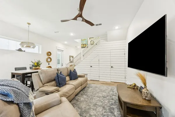 a kitchen with stainless steel appliances a stove a microwave a sink and cabinets