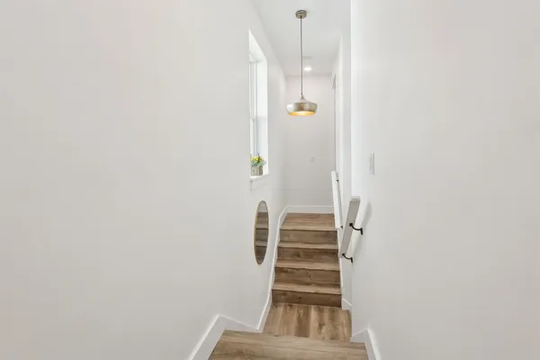 a bedroom with two beds and a table