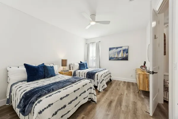 a bedroom with a bed and a mirror