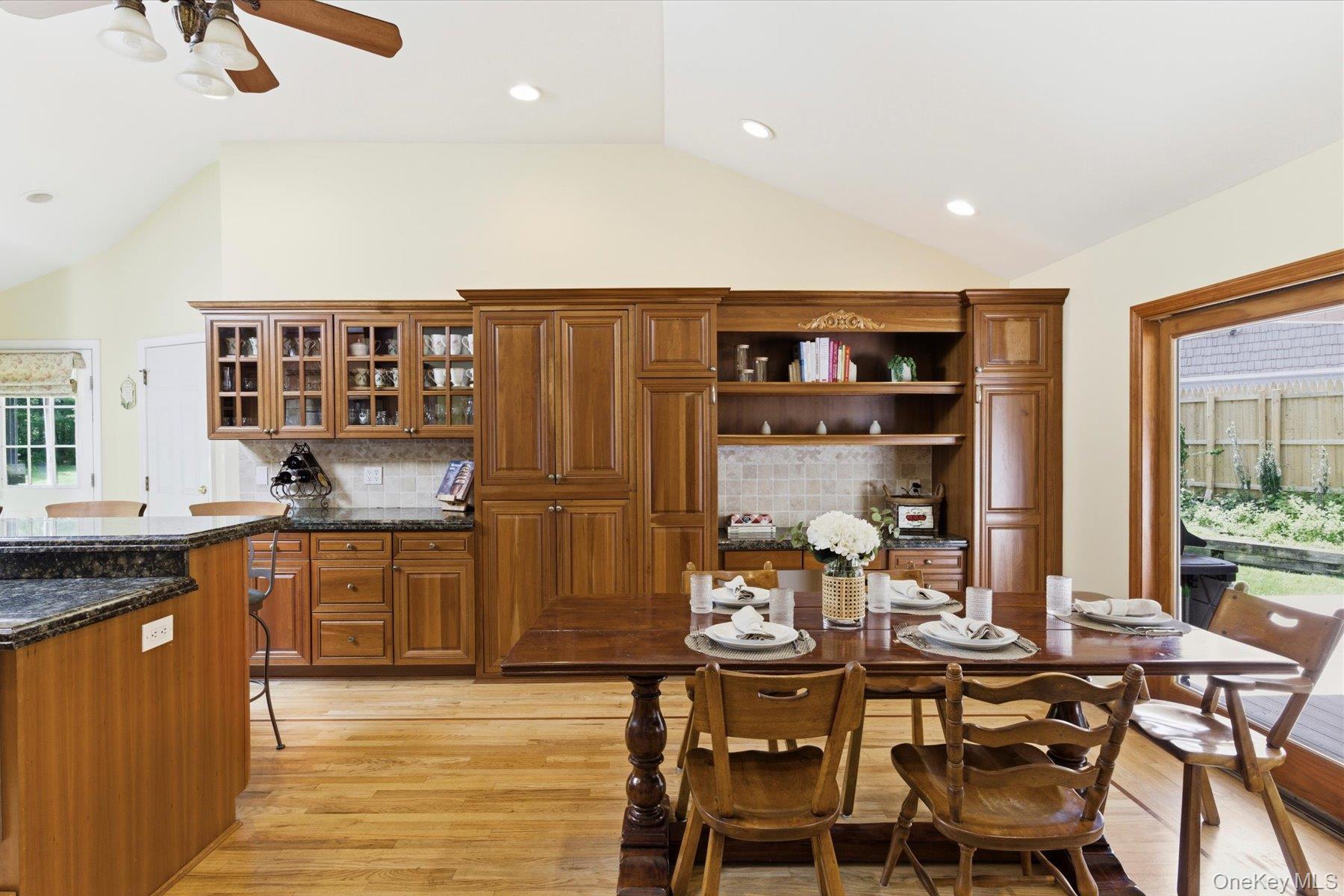 6 Brandy Road Cold Spring Harbor, NY 11724 - Photo 7 of 25 a kitchen with stainless steel appliances granite countertop a stove and a dining table chair