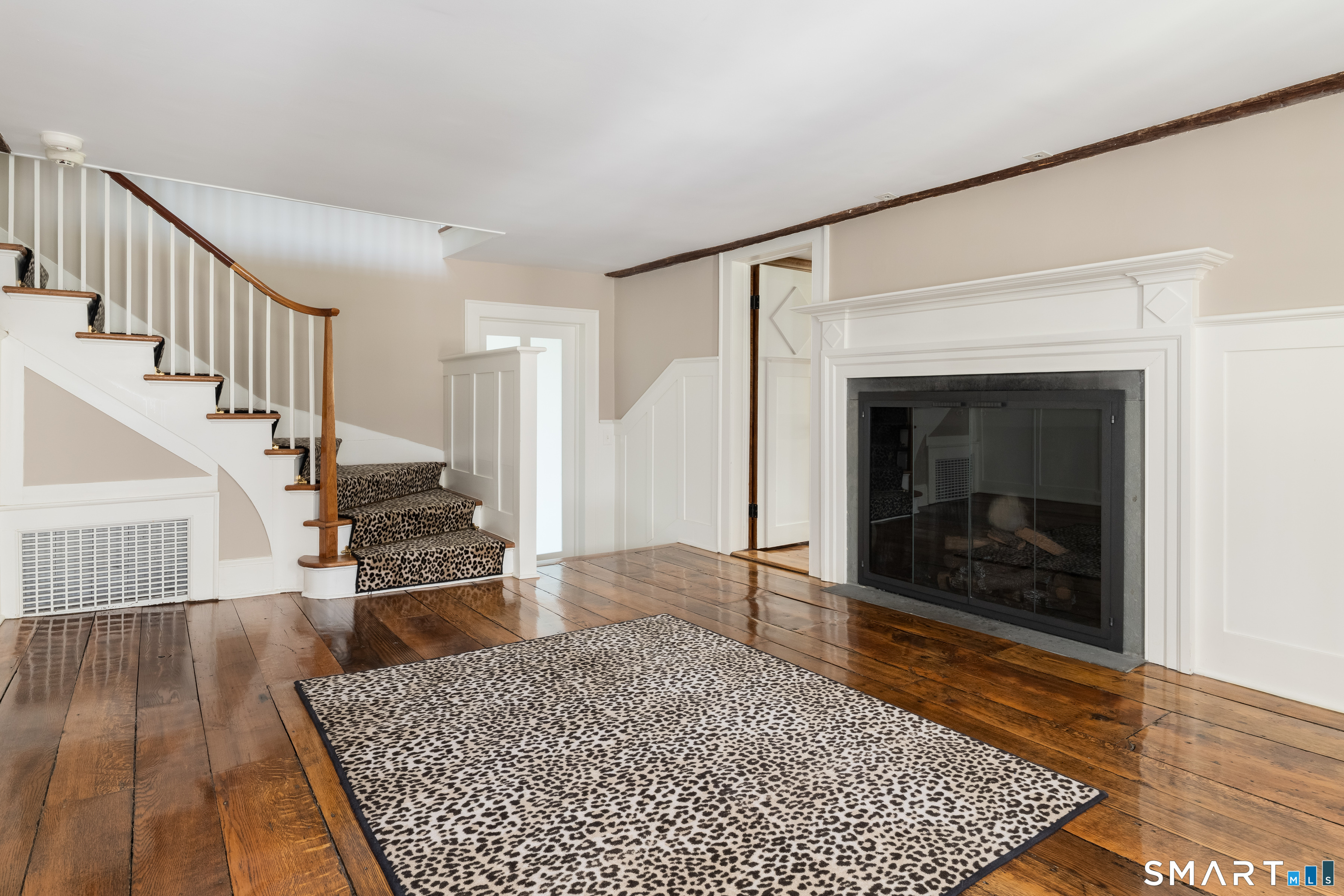 155 Long Ridge Road Danbury, CT 06810 - Photo 26 of 40 The entrance hall introduces the early 18th-century character of the house, with lower ceilings, original wide-plank floors, and a sense of age and continuity that carries through into the library beyond.