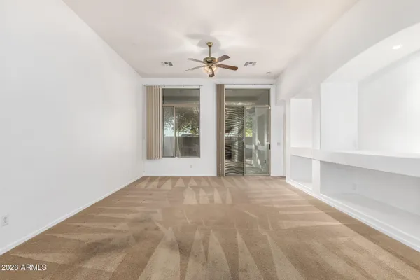 a view of an empty room with a window