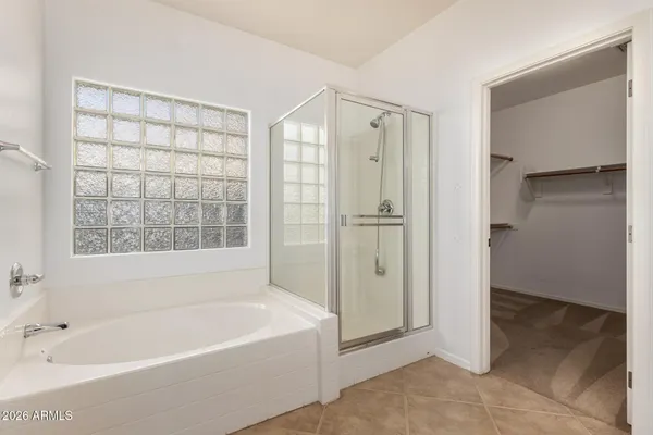 a bathroom with a double vanity sink and mirror