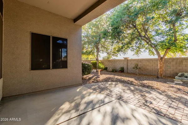 a view of a backyard of the house