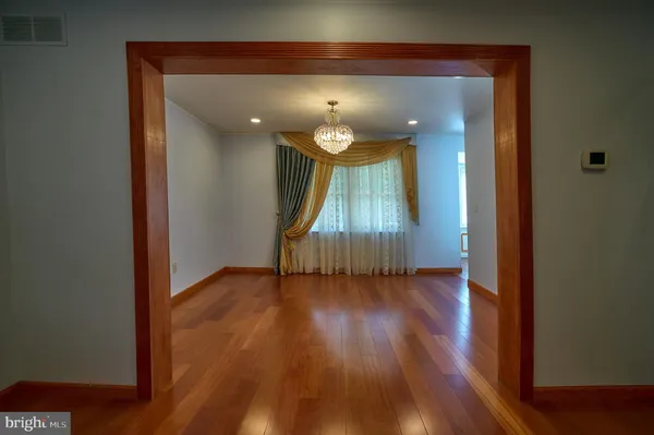 an entryway and livingroom with furniture