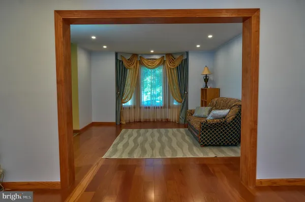 a spacious bedroom with a bed and a large window