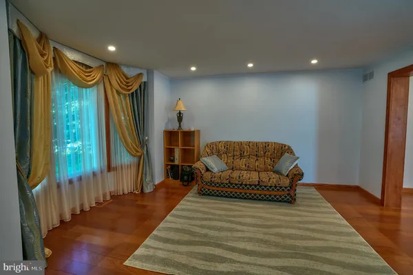 a view of a workspace with furniture and window