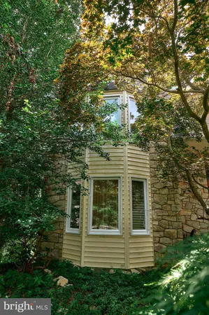 a view of a house with a tree