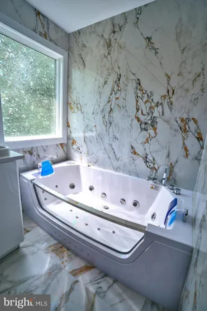 a bathroom with a shower a toilet and sink