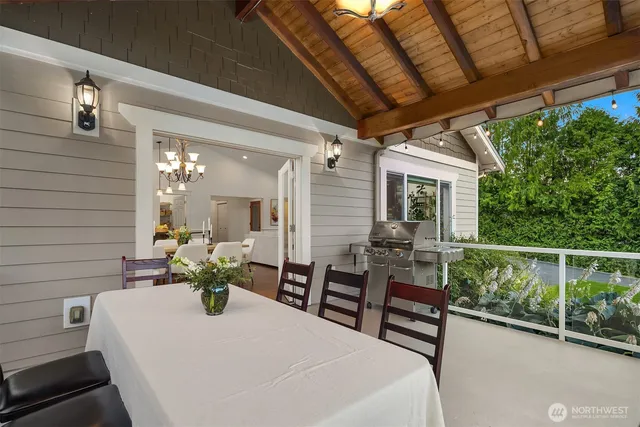 a view of a patio with table and chairs and potted plants
