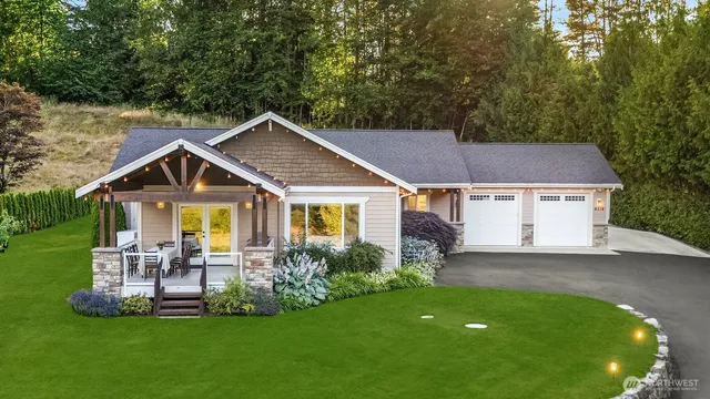 a front view of house with yard and green space