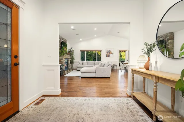 a lobby with furniture and a wooden floor