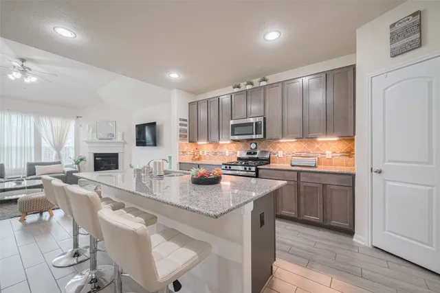 a view of a livingroom with furniture and a flat screen tv