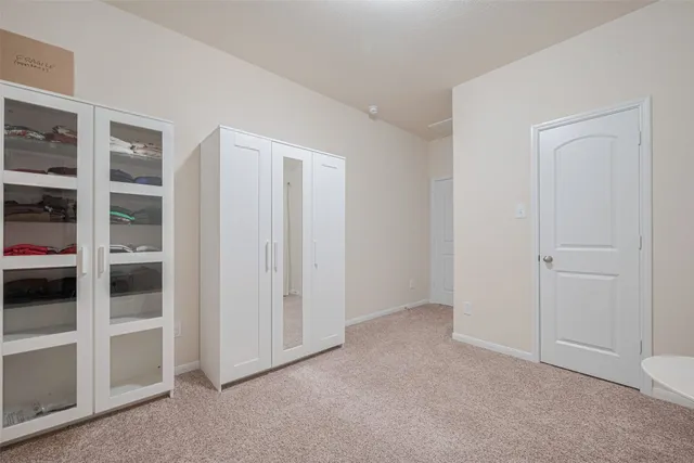 a bedroom with a bed and a night lamp