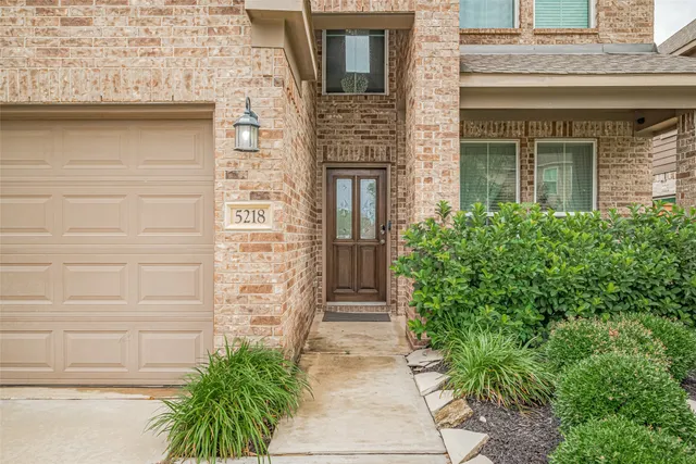 a kitchen with stainless steel appliances a refrigerator and a stove