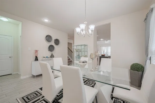 a kitchen with sink cabinets and dining table