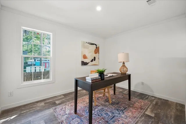 a view of a workspace with furniture