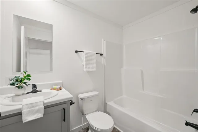 a bathroom with a sink toilet and a bathtub