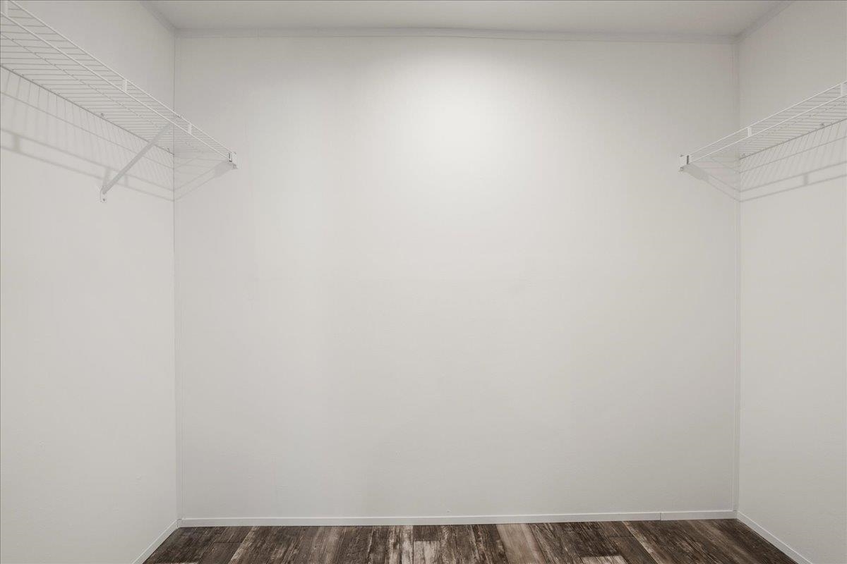 3500 Atcheson Street St. Augustine, FL 32084 - Photo 21 of 29 Walk in closet with dark wood-type flooring