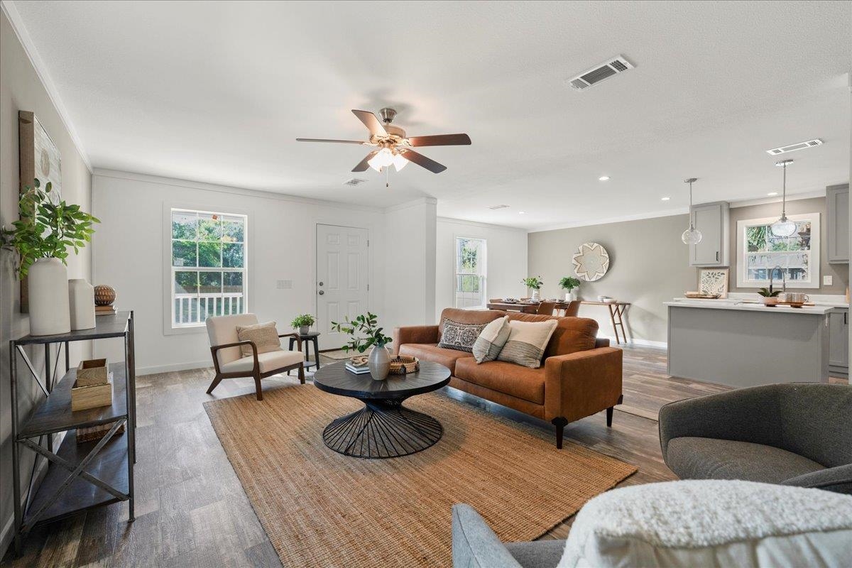 3500 Atcheson Street St. Augustine, FL 32084 - Photo 7 of 29 Living area with wood finished floors, plenty of natural light, ornamental molding, and a ceiling fan