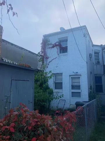 a front view of a house with a glass door