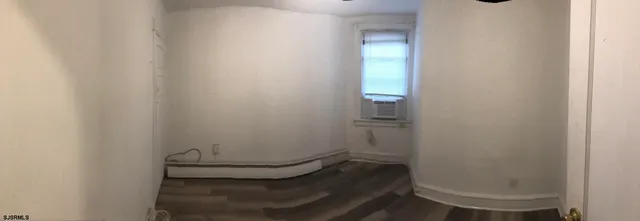 a view of a closet area with living room