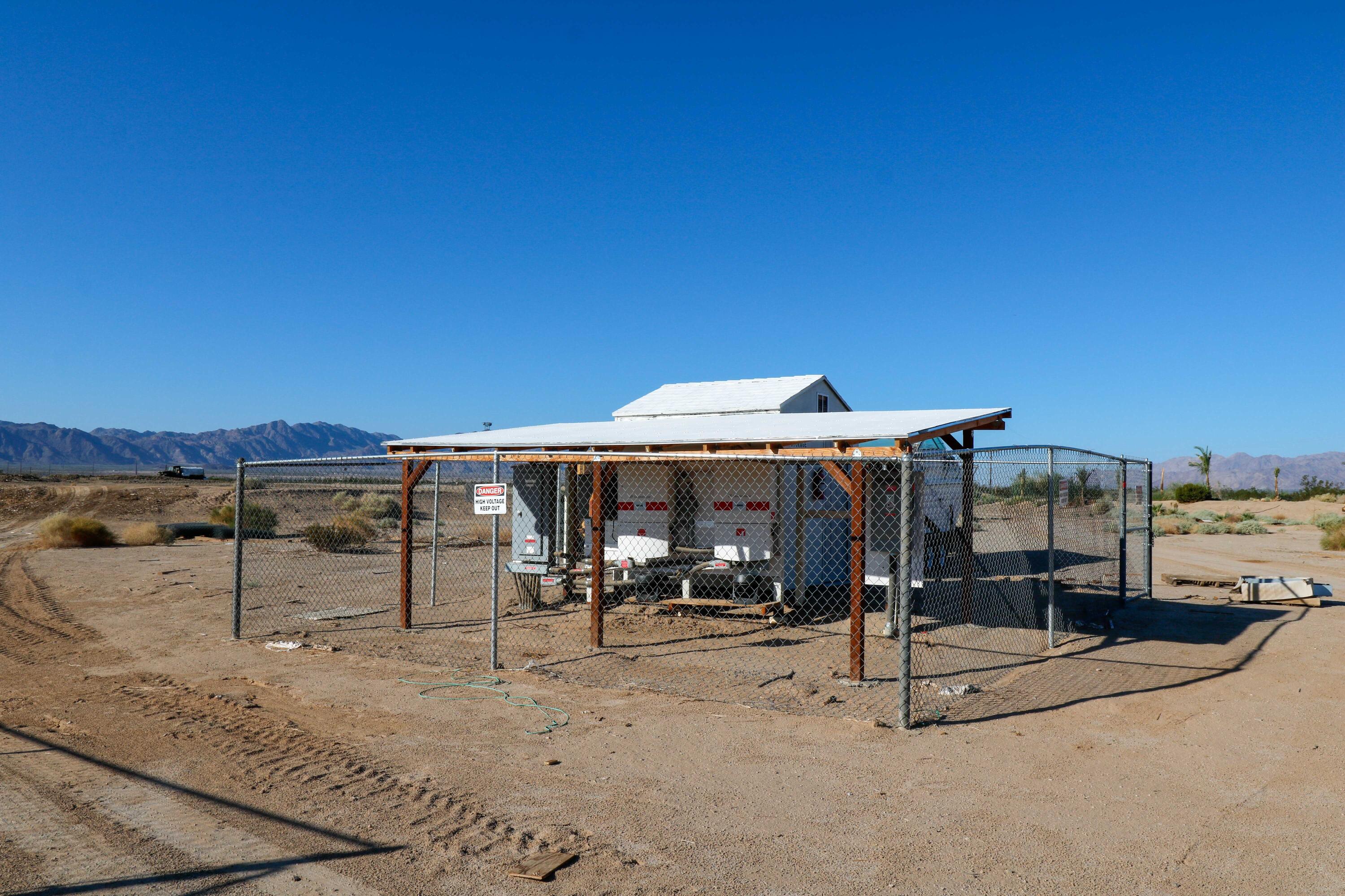 24511 Rice Road Desert Center, CA 92239 - Photo 48 of 65 a view of a patio with a table and chairs under an umbrella