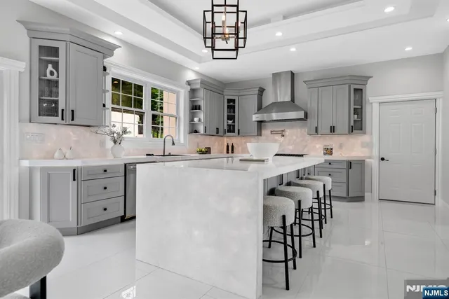 a kitchen with kitchen island cabinets and stainless steel appliances