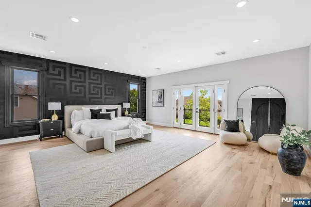 a bed room with furniture and a large window