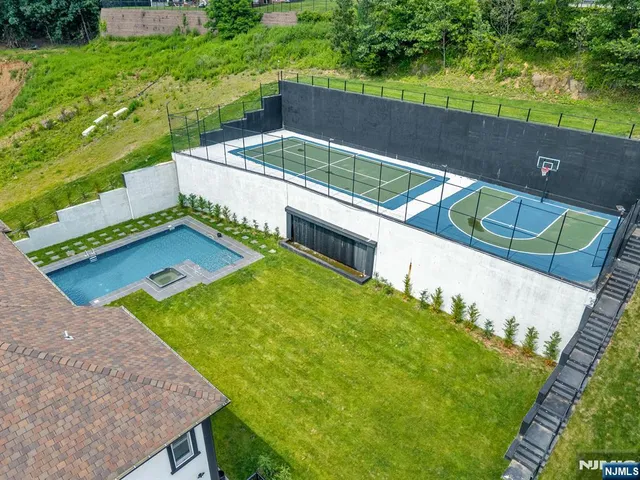 a view of a backyard with a small pool