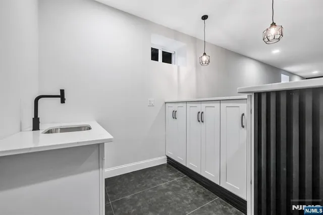 a view of a kitchen with a sink
