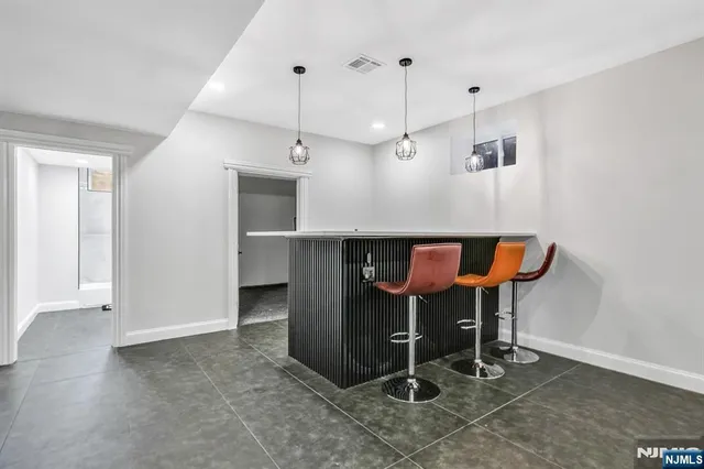 an entryway with table and mirror