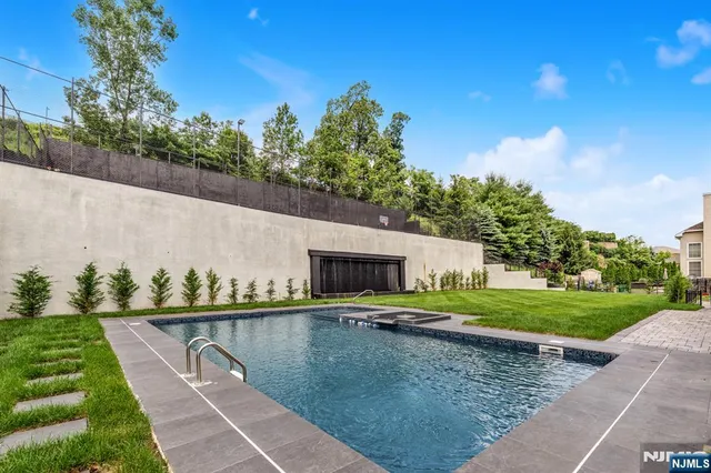 a view of a swimming pool with a yard