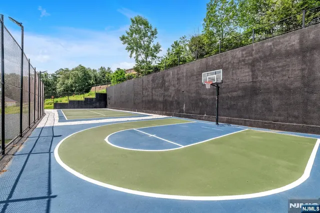 a view of a swimming pool with a yard
