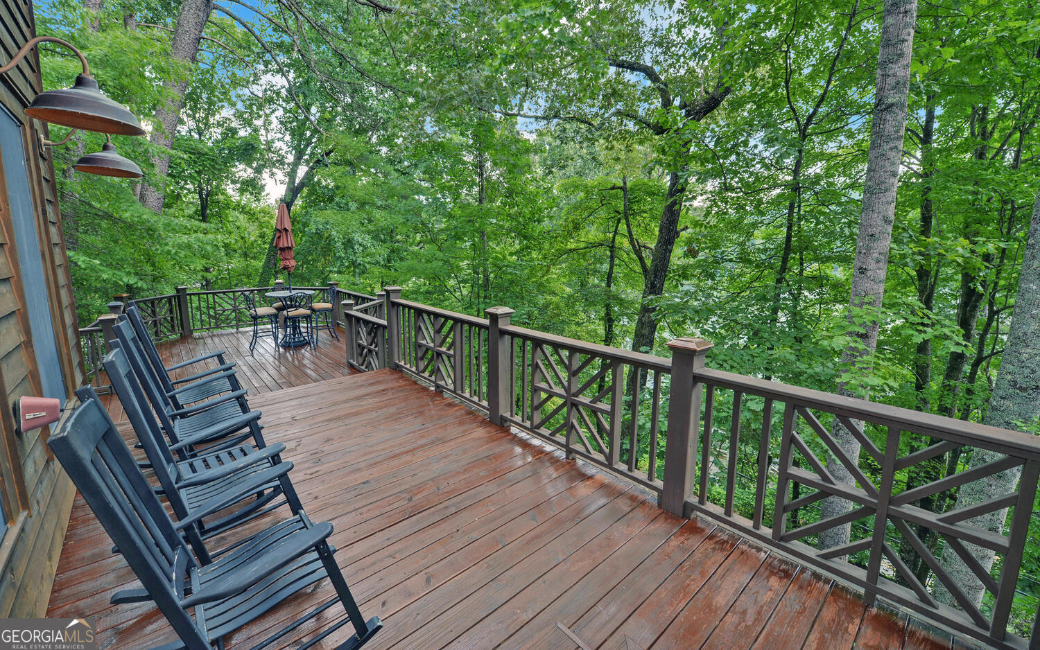 3540 Lake Rabun Road Lakemont, GA 30552 - Photo 23 of 81 a view of a balcony with wooden floor and outdoor seating